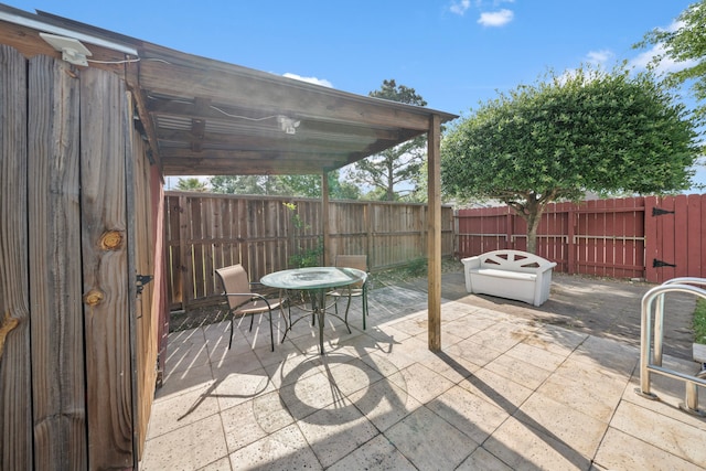 view of patio / terrace with a fenced backyard and outdoor dining space