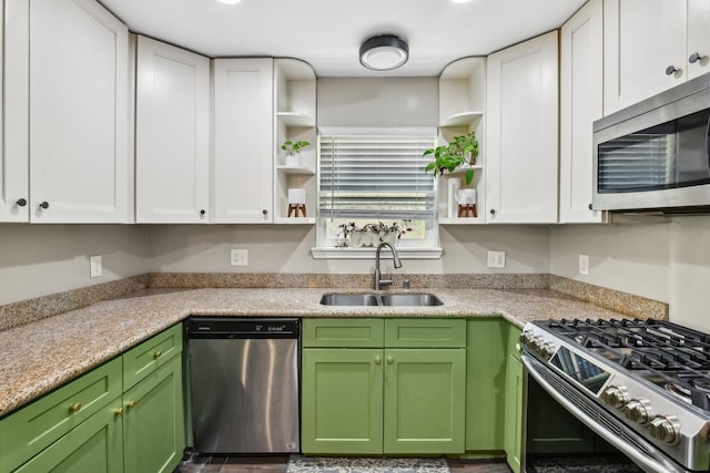 kitchen featuring open shelves, a sink, white cabinets, and stainless steel appliances