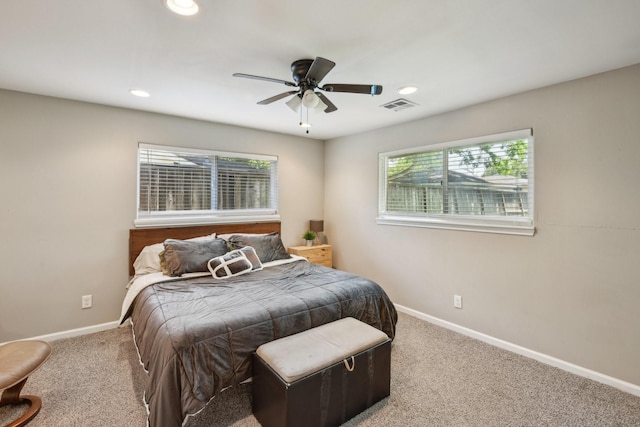 bedroom with visible vents, carpet, and baseboards