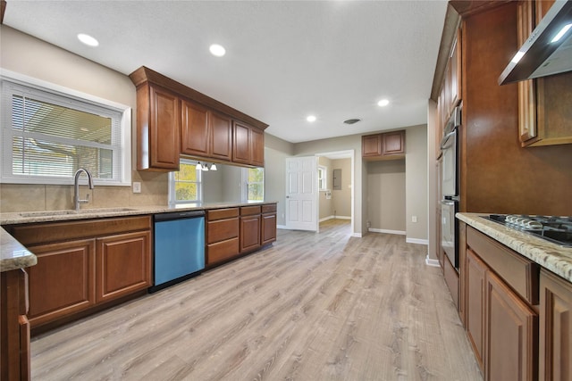 2201 Badger Ln, Huntsville, TX 77320 - kitchen with baseboards, dishwasher, a sink, ventilation hood, and black stovetop