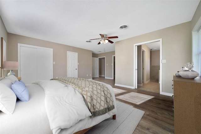 2201 Badger Ln, Huntsville, TX 77320 - bedroom with wood finished floors, baseboards, a ceiling fan, and visible vents