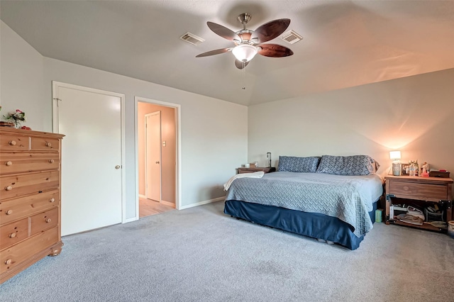 bedroom featuring visible vents, a ceiling fan, and carpet floors