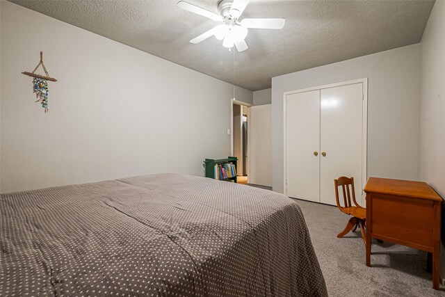 14718 Cypress Green Dr, Cypress, TX 77429 - carpeted bedroom featuring a textured ceiling, ceiling fan, and a closet