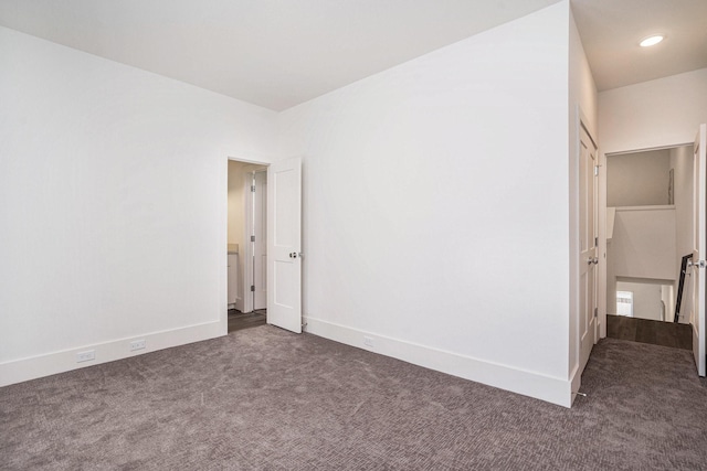 unfurnished bedroom with carpet flooring, baseboards, and recessed lighting