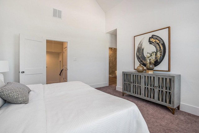 bedroom with carpet flooring, high vaulted ceiling, baseboards, and ensuite bathroom
