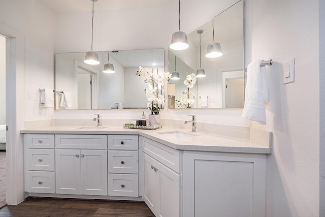 full bath with wood finished floors and double vanity