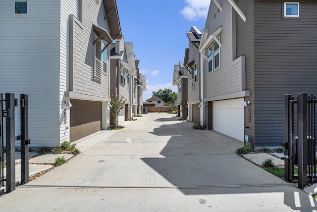 view of concrete alley with a residential view