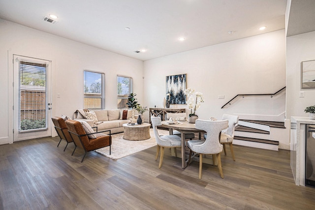 living room with wood finished floors, recessed lighting, and stairway