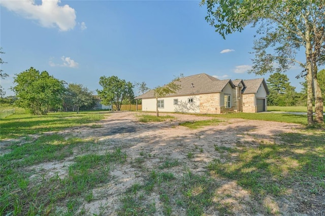 620 Lily St, Waller, TX 77484 - view of yard featuring fence and an attached garage