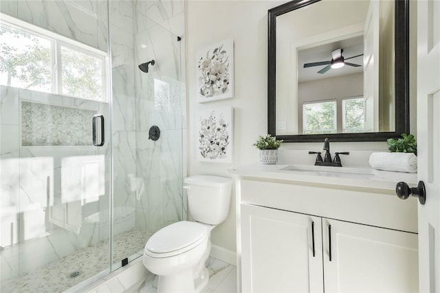 620 Lily St, Waller, TX 77484 - bathroom featuring toilet, vanity, a ceiling fan, and a marble finish shower