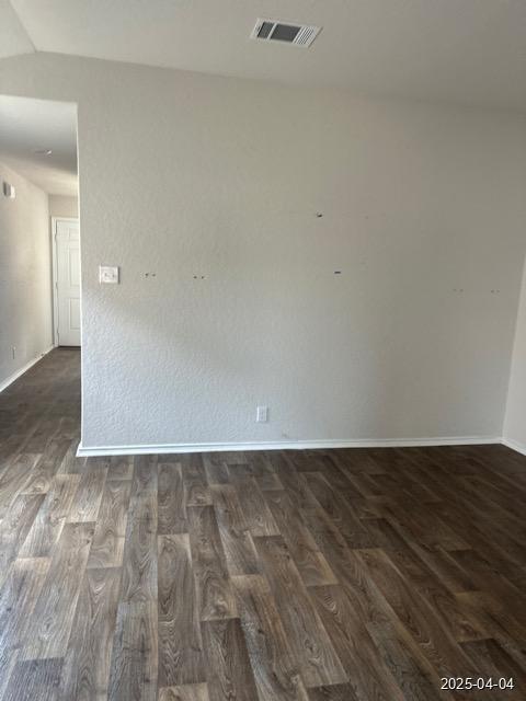 6710 Greensleeves, San Antonio, TX 78252 - unfurnished room with visible vents, baseboards, and dark wood-style floors