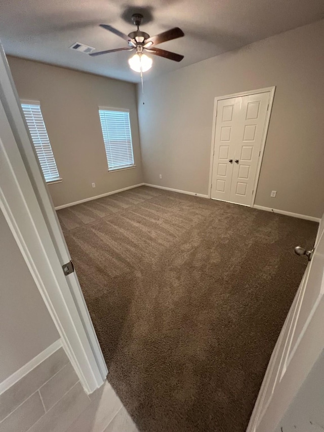 526 Emerald Thicket Ln, Huffman, TX 77336 - empty room featuring ceiling fan, baseboards, and carpet