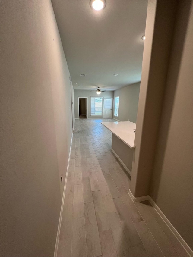 526 Emerald Thicket Ln, Huffman, TX 77336 - hall featuring light wood finished floors and baseboards