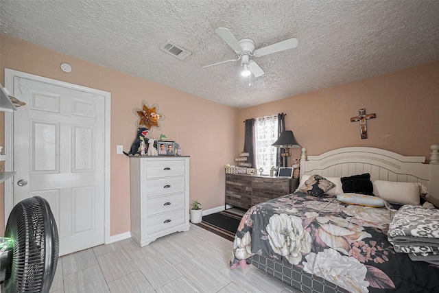9034 Talton St, Houston, TX 77078 - bedroom with a textured ceiling, ceiling fan, and visible vents