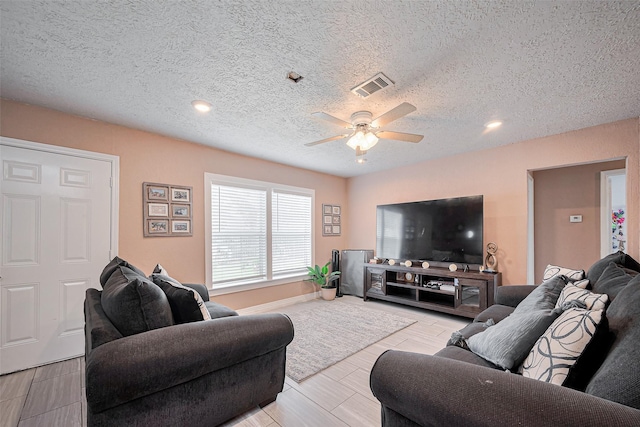 9034 Talton St, Houston, TX 77078 - living area with visible vents, a ceiling fan, recessed lighting, and a textured ceiling