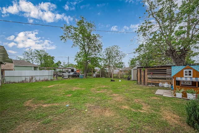 9034 Talton St, Houston, TX 77078 - view of yard featuring fence and an outbuilding