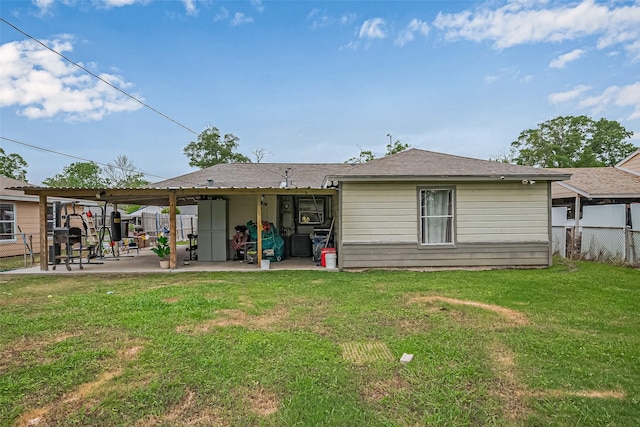 9034 Talton St, Houston, TX 77078 - rear view of house featuring a patio, fence, and a lawn