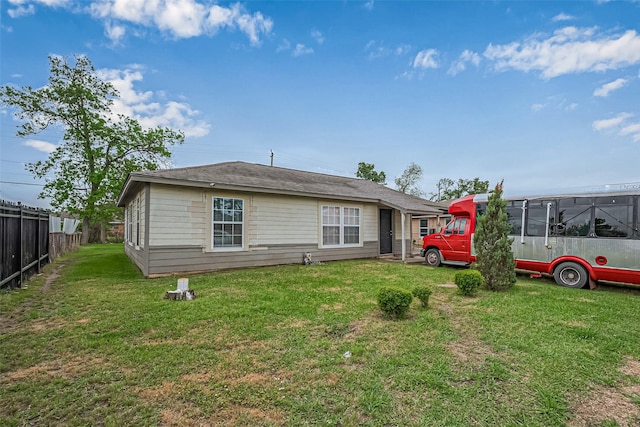9034 Talton St, Houston, TX 77078 - rear view of property with fence and a lawn
