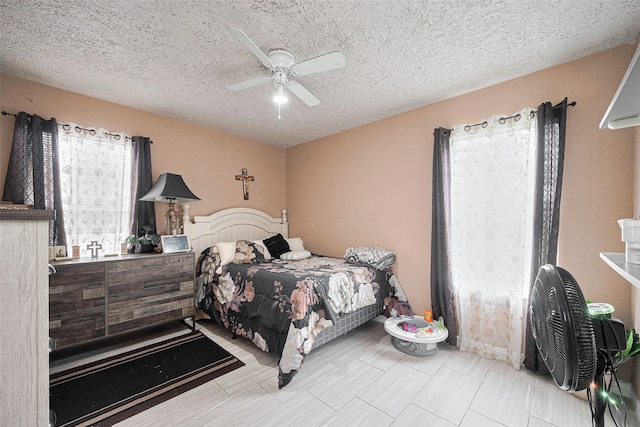 9034 Talton St, Houston, TX 77078 - bedroom featuring a textured ceiling and ceiling fan