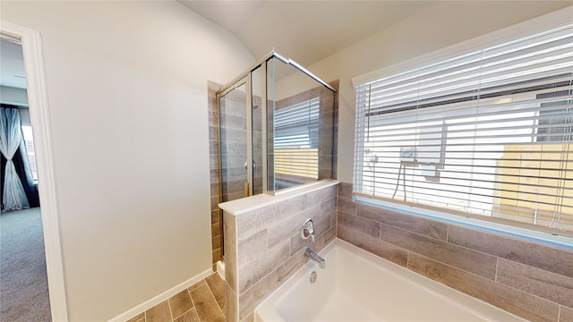 full bath with a bath and a stall shower