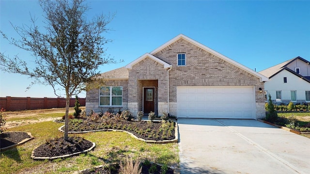 view of front of property featuring stone siding, fence, brick siding, an attached garage, and concrete driveway