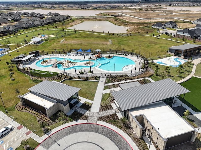 drone / aerial view with a residential view and a water view