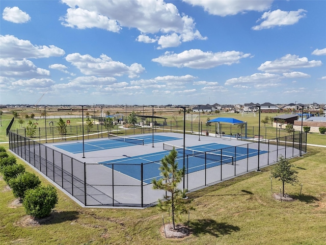 view of pool with a tennis court, fence, and a lawn