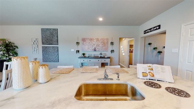 kitchen with light countertops and a sink