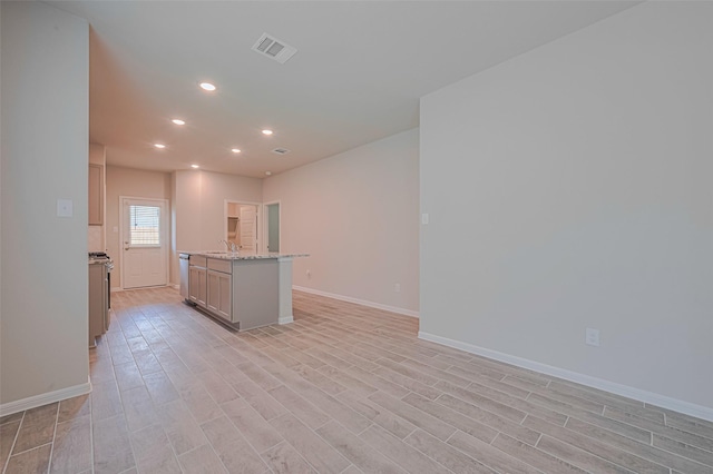 17726 Pamukkale Pl, Tomball, TX 77377 - kitchen featuring light wood finished floors, baseboards, recessed lighting, a sink, and stainless steel appliances
