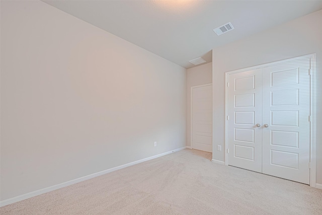 17726 Pamukkale Pl, Tomball, TX 77377 - unfurnished bedroom with light colored carpet, baseboards, and a closet