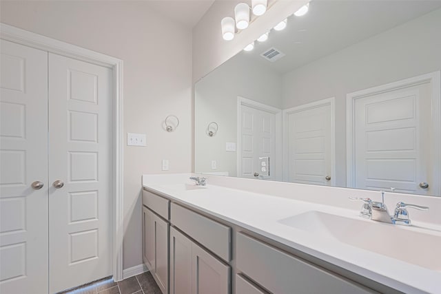 17726 Pamukkale Pl, Tomball, TX 77377 - bathroom featuring double vanity and baseboards
