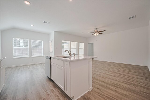 22607 Rising Rosehill Ln, Tomball, TX 77377 - kitchen featuring a sink, stainless steel dishwasher, a ceiling fan, light wood-style floors, and open floor plan