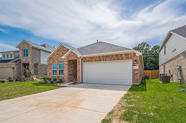 22607 Rising Rosehill Ln, Tomball, TX 77377 - view of front of home with brick siding, driveway, a garage, roof with shingles, and central AC