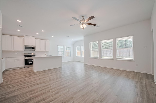 22607 Rising Rosehill Ln, Tomball, TX 77377 - unfurnished living room with light wood-style floors, recessed lighting, a ceiling fan, and baseboards