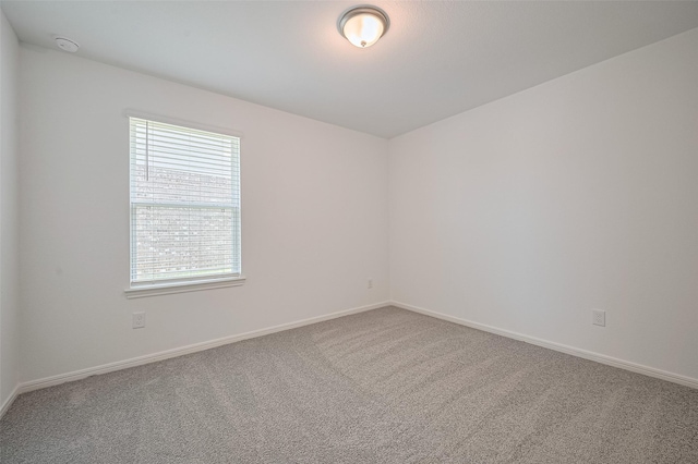 22607 Rising Rosehill Ln, Tomball, TX 77377 - carpeted spare room featuring baseboards and a smoke detector
