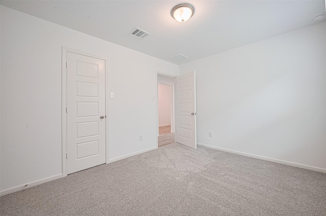 22607 Rising Rosehill Ln, Tomball, TX 77377 - spare room featuring light carpet and baseboards