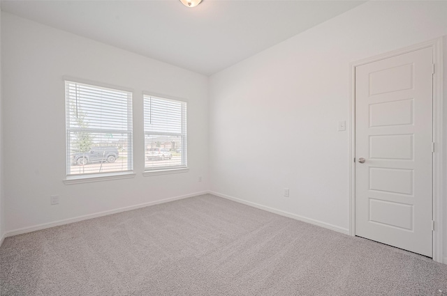 22607 Rising Rosehill Ln, Tomball, TX 77377 - spare room featuring carpet floors and baseboards