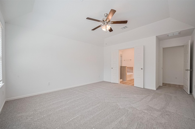 22607 Rising Rosehill Ln, Tomball, TX 77377 - unfurnished bedroom featuring light colored carpet, baseboards, lofted ceiling, ceiling fan, and connected bathroom