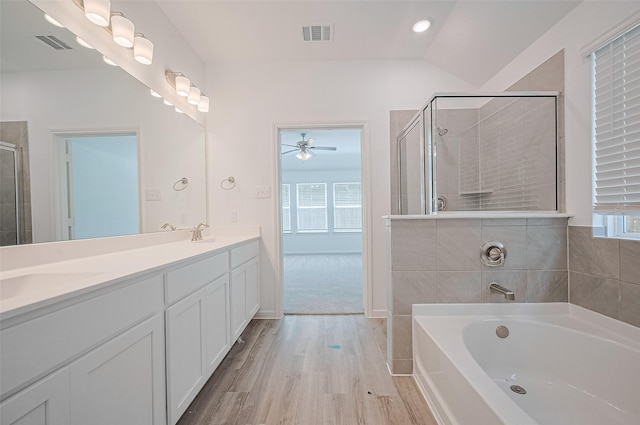 22607 Rising Rosehill Ln, Tomball, TX 77377 - bathroom featuring ceiling fan, wood finished floors, a garden tub, double vanity, and a tile shower