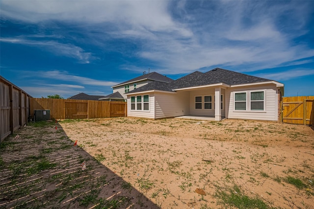 22607 Rising Rosehill Ln, Tomball, TX 77377 - rear view of property with a fenced backyard, roof with shingles, and a patio area