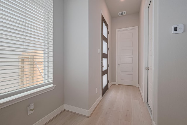 8915 Grovner Pl, Houston, TX 77055 - corridor with light wood-style flooring and baseboards
