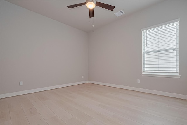 8915 Grovner Pl, Houston, TX 77055 - empty room featuring a ceiling fan, light wood-style flooring, and baseboards