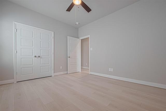 8915 Grovner Pl, Houston, TX 77055 - unfurnished bedroom featuring light wood finished floors, baseboards, a ceiling fan, and a closet