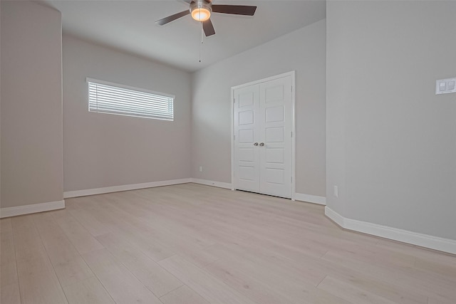8915 Grovner Pl, Houston, TX 77055 - spare room with ceiling fan, light wood-type flooring, and baseboards