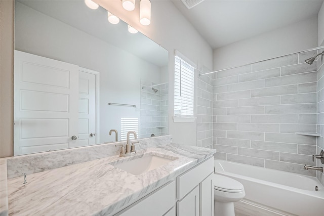 full bathroom with toilet, visible vents, bathtub / shower combination, and vanity