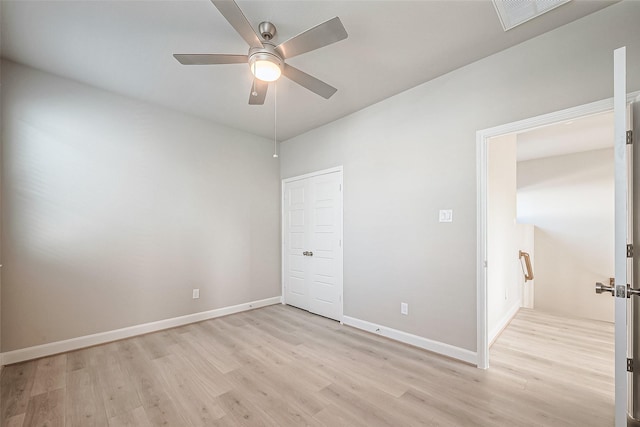 unfurnished bedroom with light wood-style floors, visible vents, baseboards, and a ceiling fan
