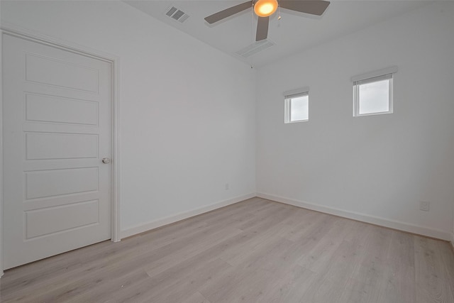 1611 Regents Gate Ct, Houston, TX 77055 - unfurnished room featuring light wood-style flooring, a ceiling fan, and baseboards