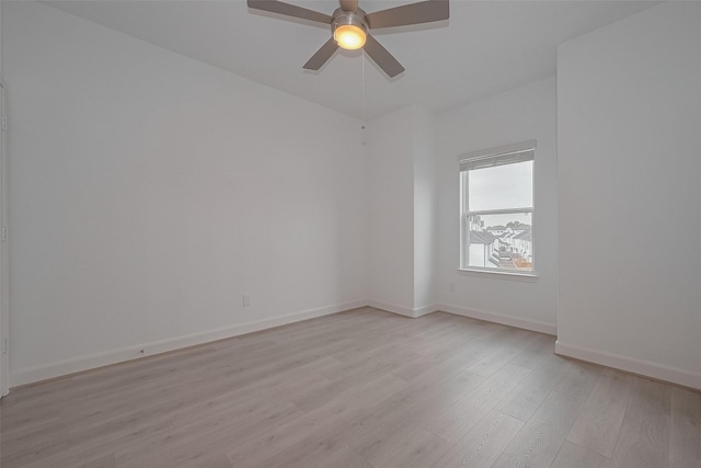 1611 Regents Gate Ct, Houston, TX 77055 - unfurnished room featuring light wood-type flooring, ceiling fan, and baseboards