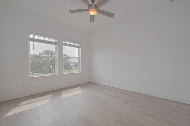 1611 Regents Gate Ct, Houston, TX 77055 - spare room featuring light wood-style flooring, baseboards, and ceiling fan
