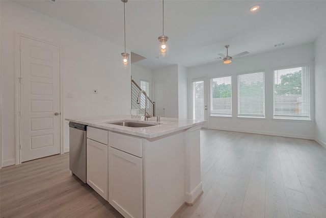 1611 Regents Gate Ct, Houston, TX 77055 - kitchen featuring a sink, stainless steel dishwasher, healthy amount of natural light, a ceiling fan, and recessed lighting